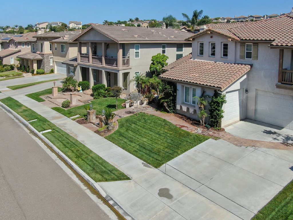 Luxury Planned Community Architecture in San Diego Suburbs with Manicured Lawns and Stucco Exteriors.jpg