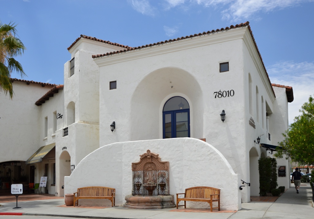 Mediterranean Revival Commercial Building with White Stucco Arched Entry and Tiered Fountain.jpg