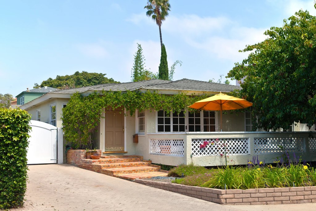 Pacific Beach California Cottage with Brick Steps Lattice Railing and Yellow Patio Umbrella.jpg