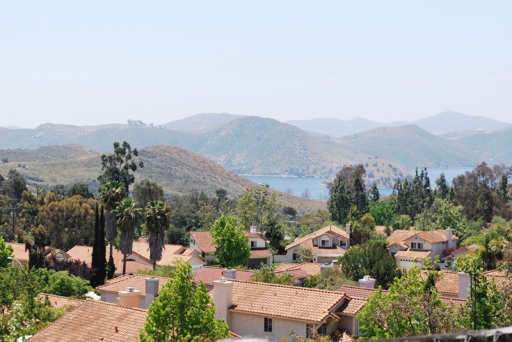 Suburban Chula Vista Neighborhood with Spanish Tile Roofs and Scenic Lower Otay Lake Reservoir Hillsides.jpg